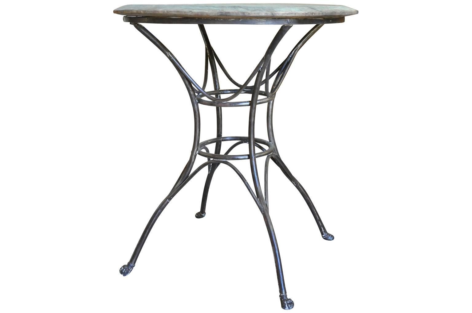 A delightful later 19th century Bistro Table from the Paris region. Beautifully constructed from sculptural iron work and a beautifully patina'd top. An excellent side table for any interior of garden.