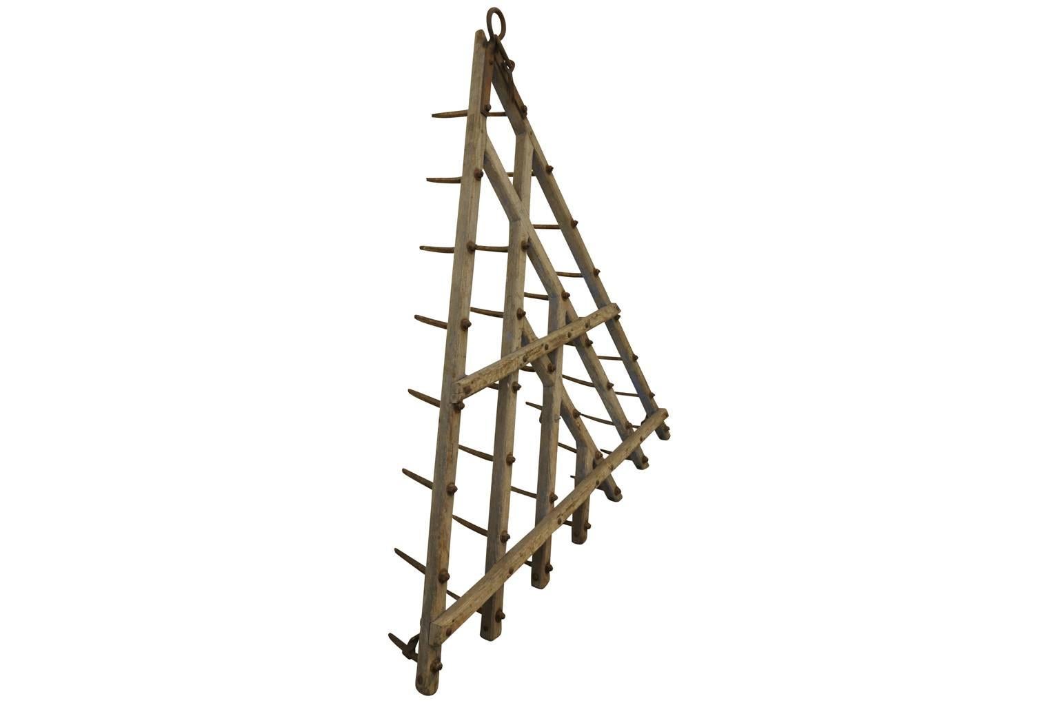 A fabulous mid-19th century plow from the Catalan region of Spain. Sturdily constructed from wood and iron. These pieces are wonderful as wall-mounted art, coat racks or converted into light fixtures.
