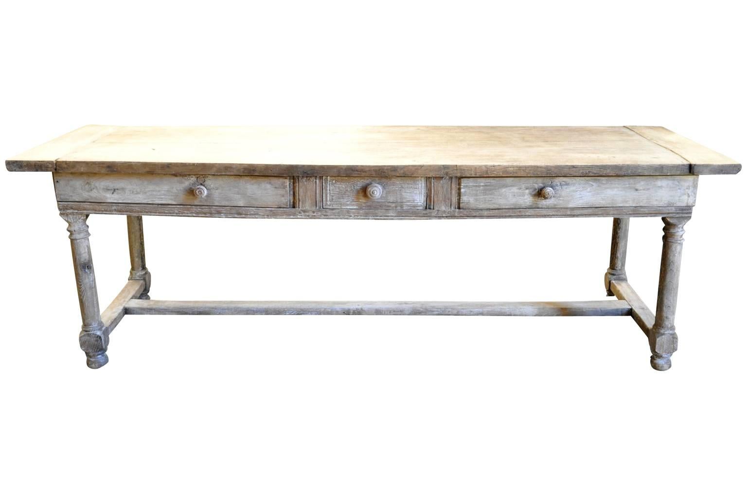 A very handsome mid-19th century console table from the Provence region of France. Wonderfully crafted from washed or bleached oak with two sliding panels and a drawer.