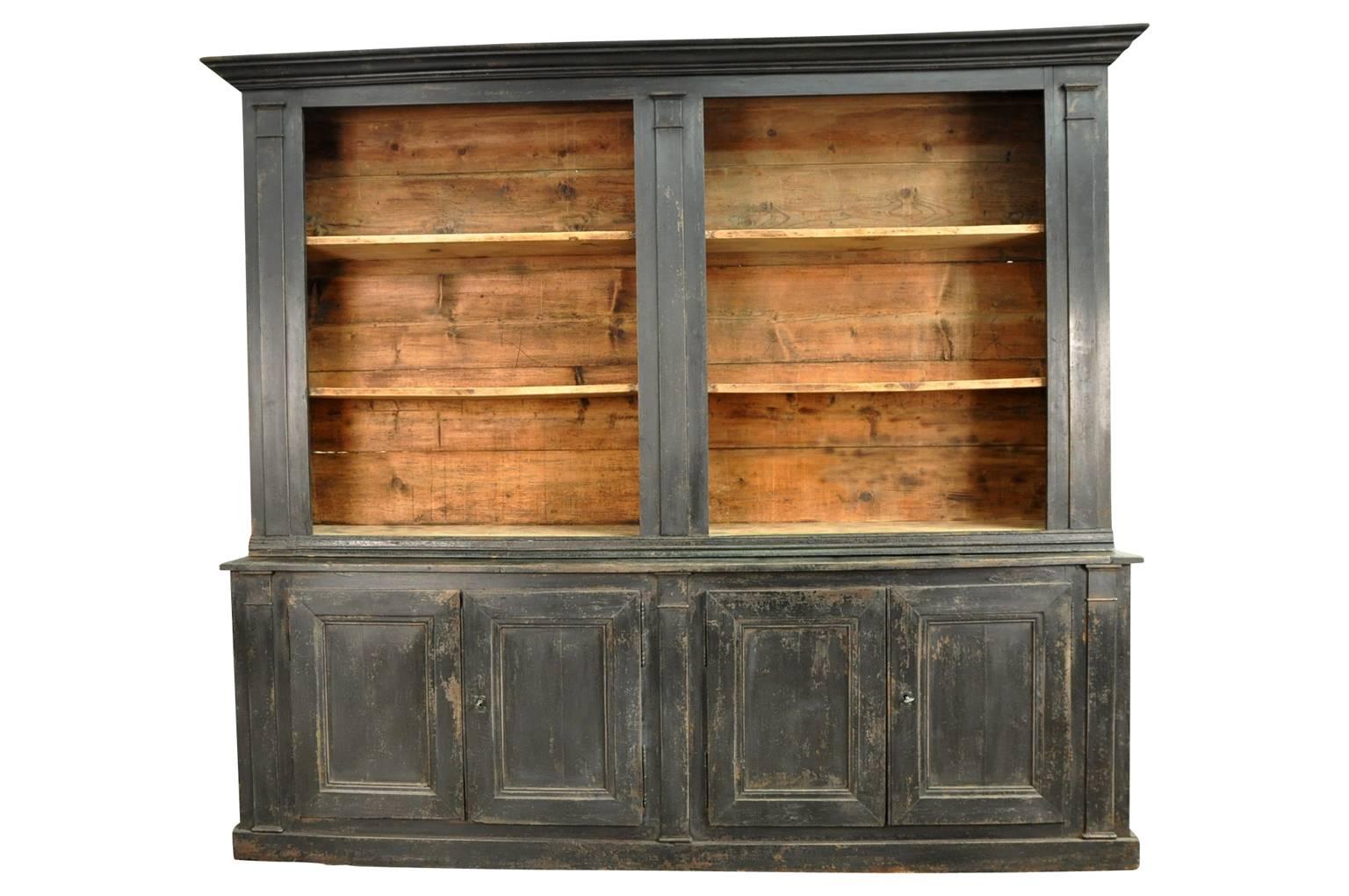 A very handsome early 19th century French Directoire period Bibliotheque, bookcase in painted wood. Its large-scale gives this piece an impressive presence. Wonderful for the display of an art or book collection with ample storage space.