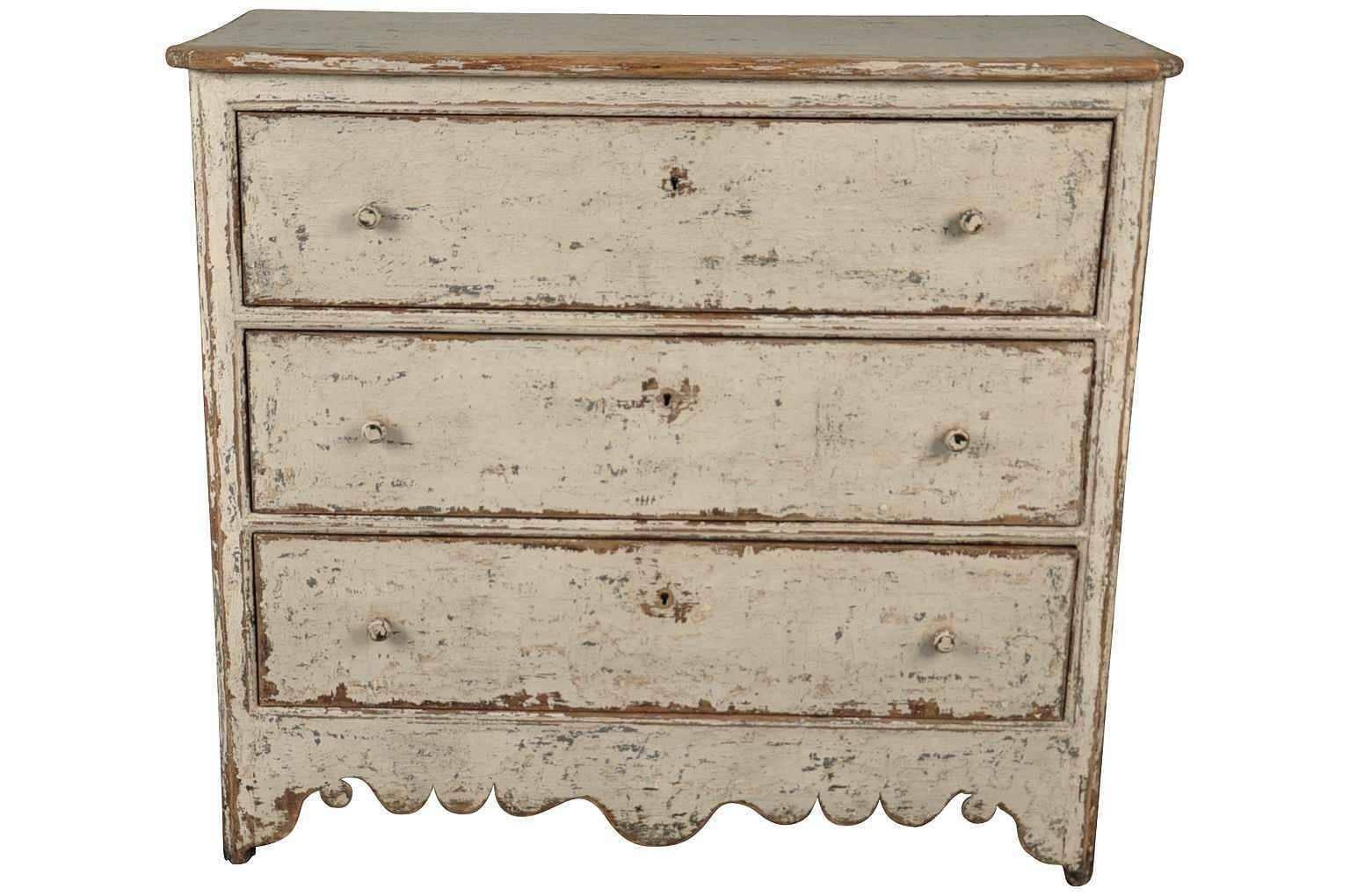 A charming later 19th century commode from Spain in painted wood. Great patina and painted finish.