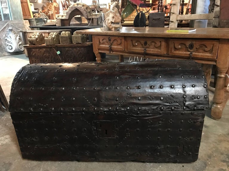 A very handsome 17th century marriage trunk from the Catalan region of Spain. Beautifully constructed from wood, clad with leather and wonderful iron ornamentation and hardware. A terrific storage piece that will serve nicely at the foot of a bed,