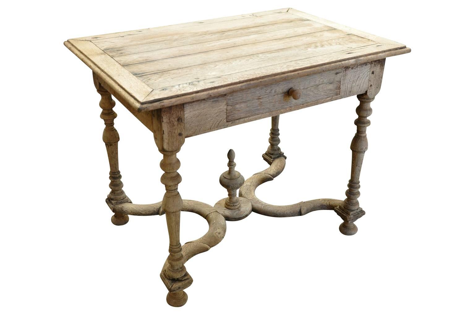 A very charming mid-19th century French Louis XIII style writing table - side table. Beautifully constructed in washed or bleached oak - this piece serves wonderfully as a bedside table as well.