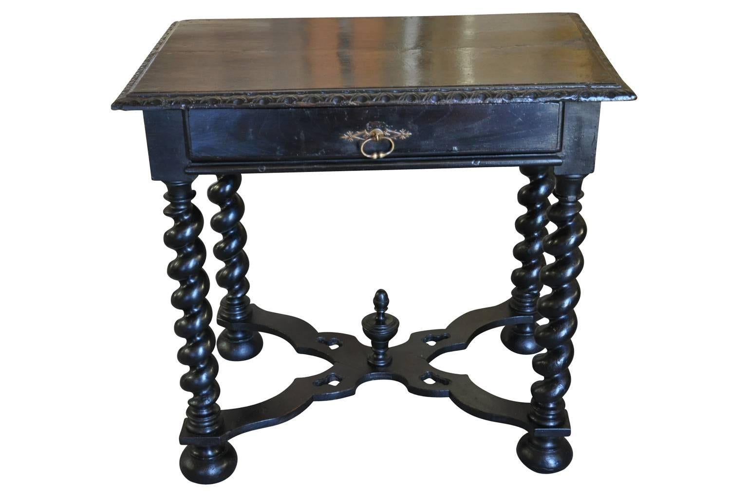 A very handsome mid-19th century Louis XIII style writing table - side table in ebonized walnut. Beautifully constructed with a single drawer, turned legs and finial topped cross stretchers. Wonderful as an end table or bedside table as well.