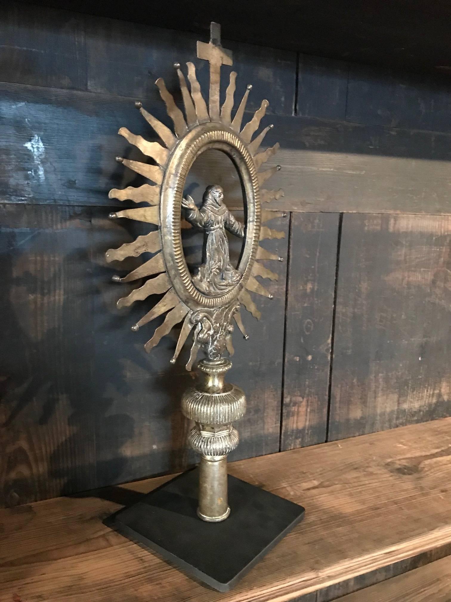 A very beautiful 19th century French metalwork that adorned a Crosier - sceptre or staff. Wonderfully crafted in metal with Saint Francis of Assisi surrounded by a stunning sunburst - now mounted on an iron base.