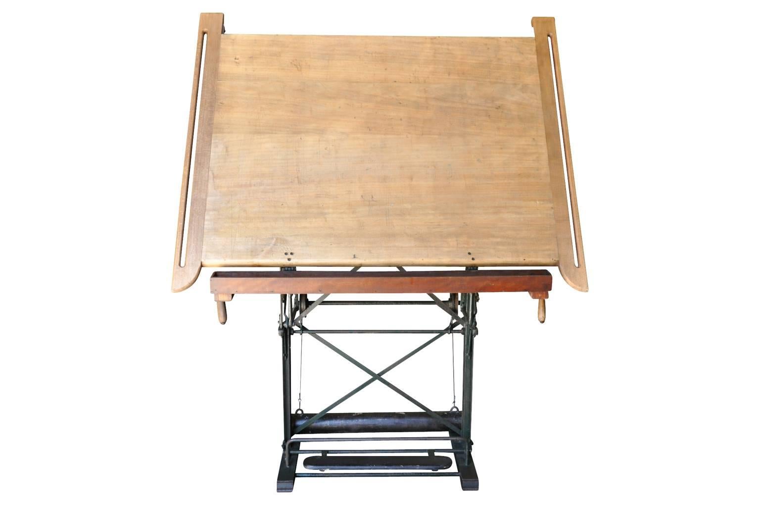 A wonderful early 20th century drafting table, architect's drawing table from France. Soundly constructed in beechwood. Not only great to draw from but a terrific decorative piece that serves beautifully as an easel for the display of a painting or