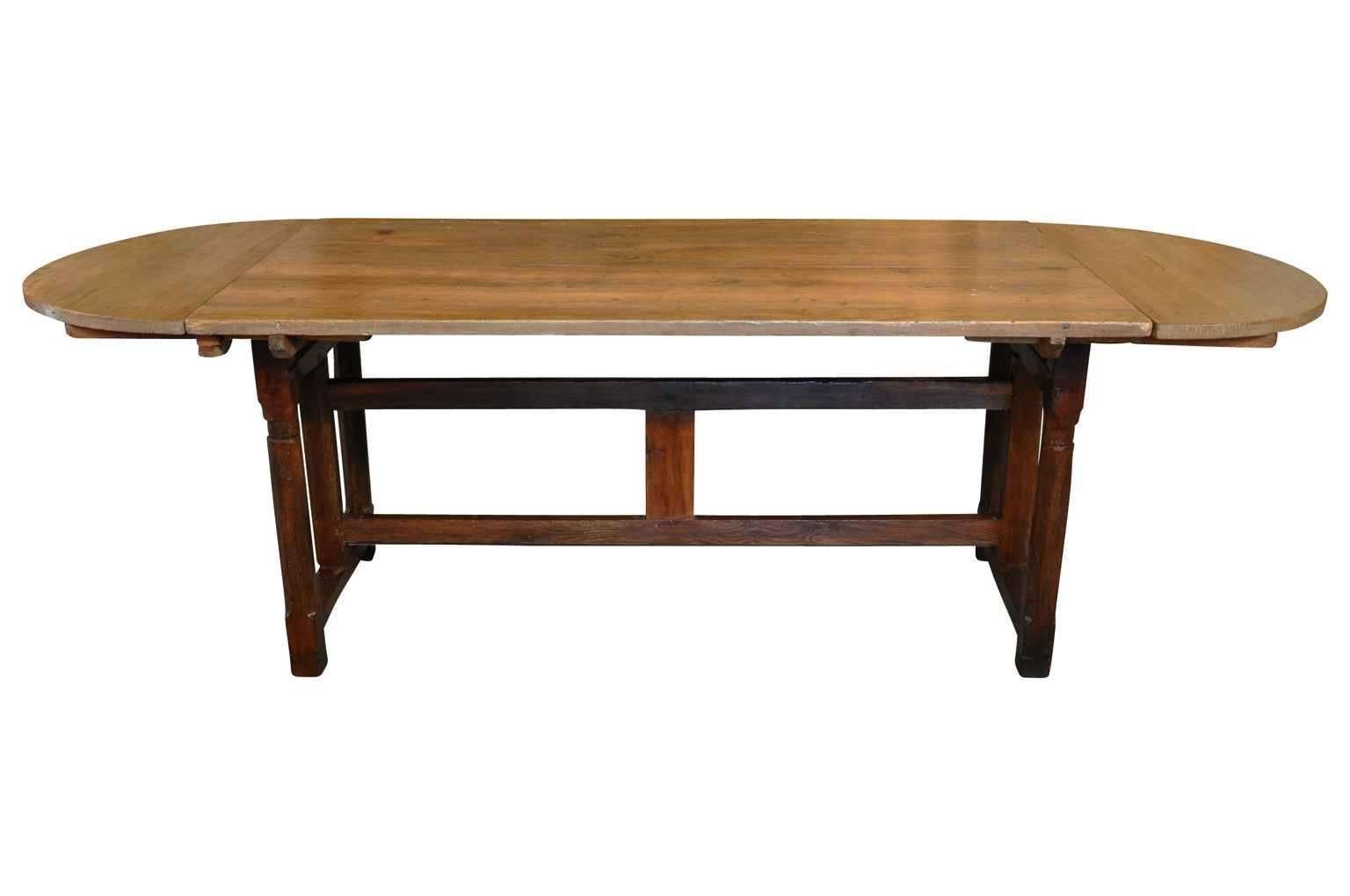 A wonderful later 19th-early 20th century French dining table. This terrific table disassembles for easy transport and storage. Sturdily constructed from sound oak.