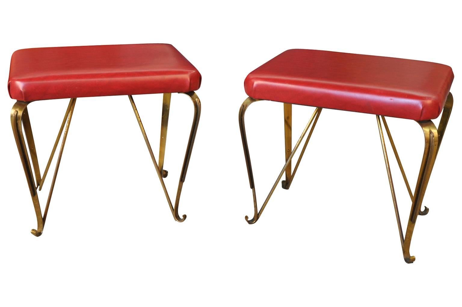 A terrific pair of Italian Mid-Century Modern stools. Wonderful design and constructed from patinated metal. Great accent pieces to give style and color to an interior.