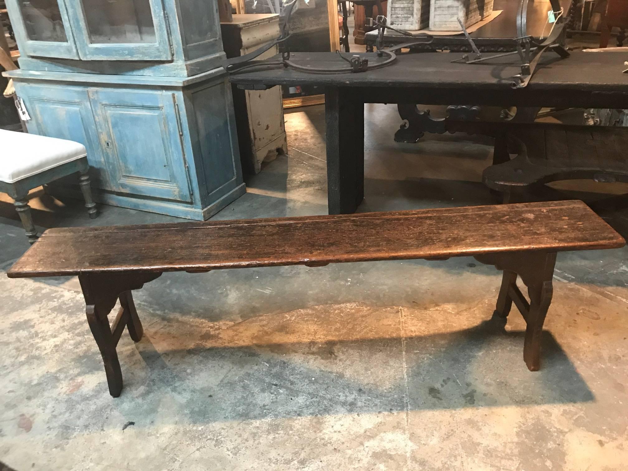 A very handsome primitive 19th century bench from the Catalan region of Spain. Beautifully constructed from richly stained pine.