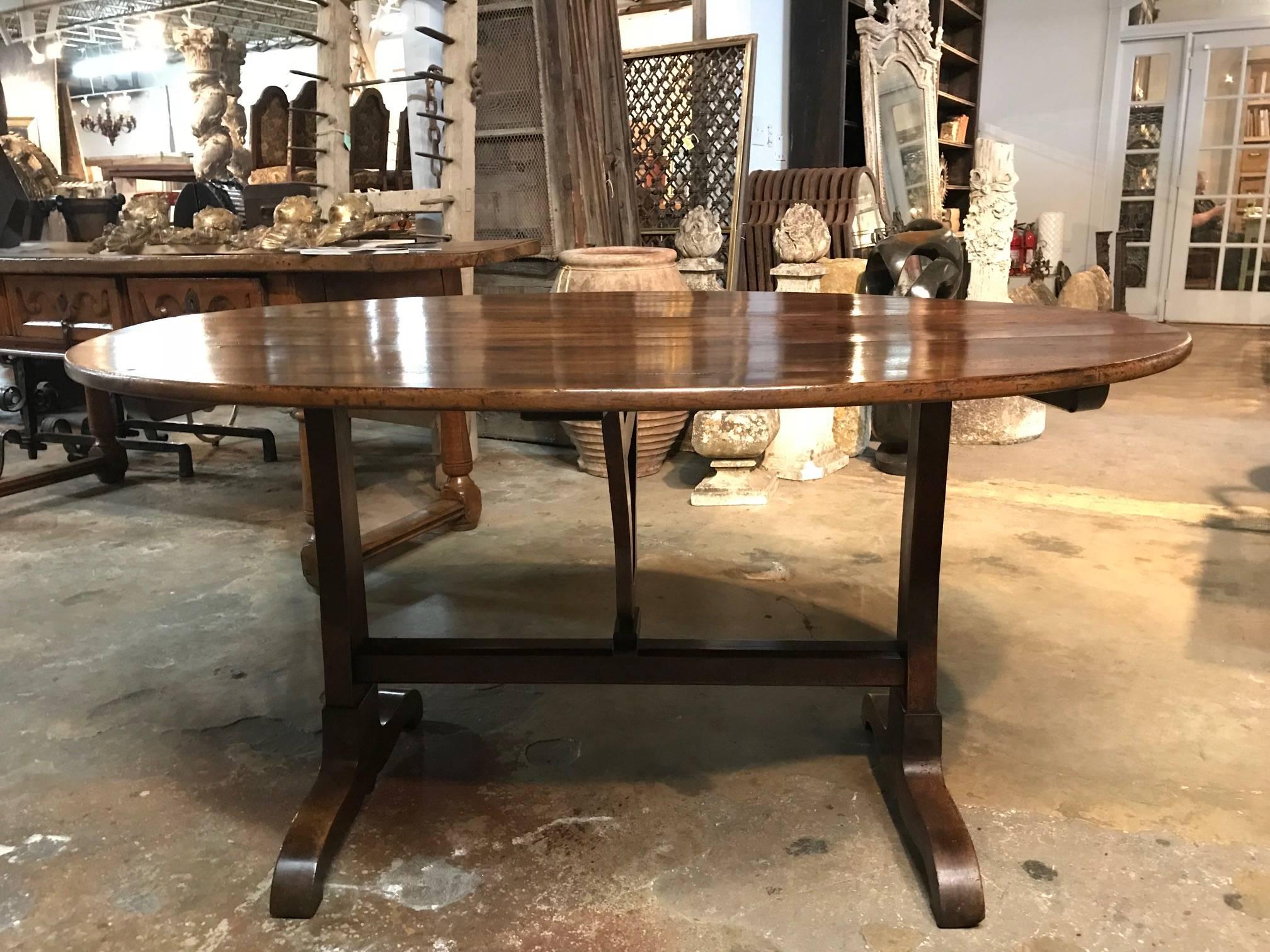 A sensational mid-19th century table De Vigneron - wine tasting table. Wonderfully and very soundly constructed from thick planks of beautifully patina walnut. The oval shape makes this table even more exceptional.