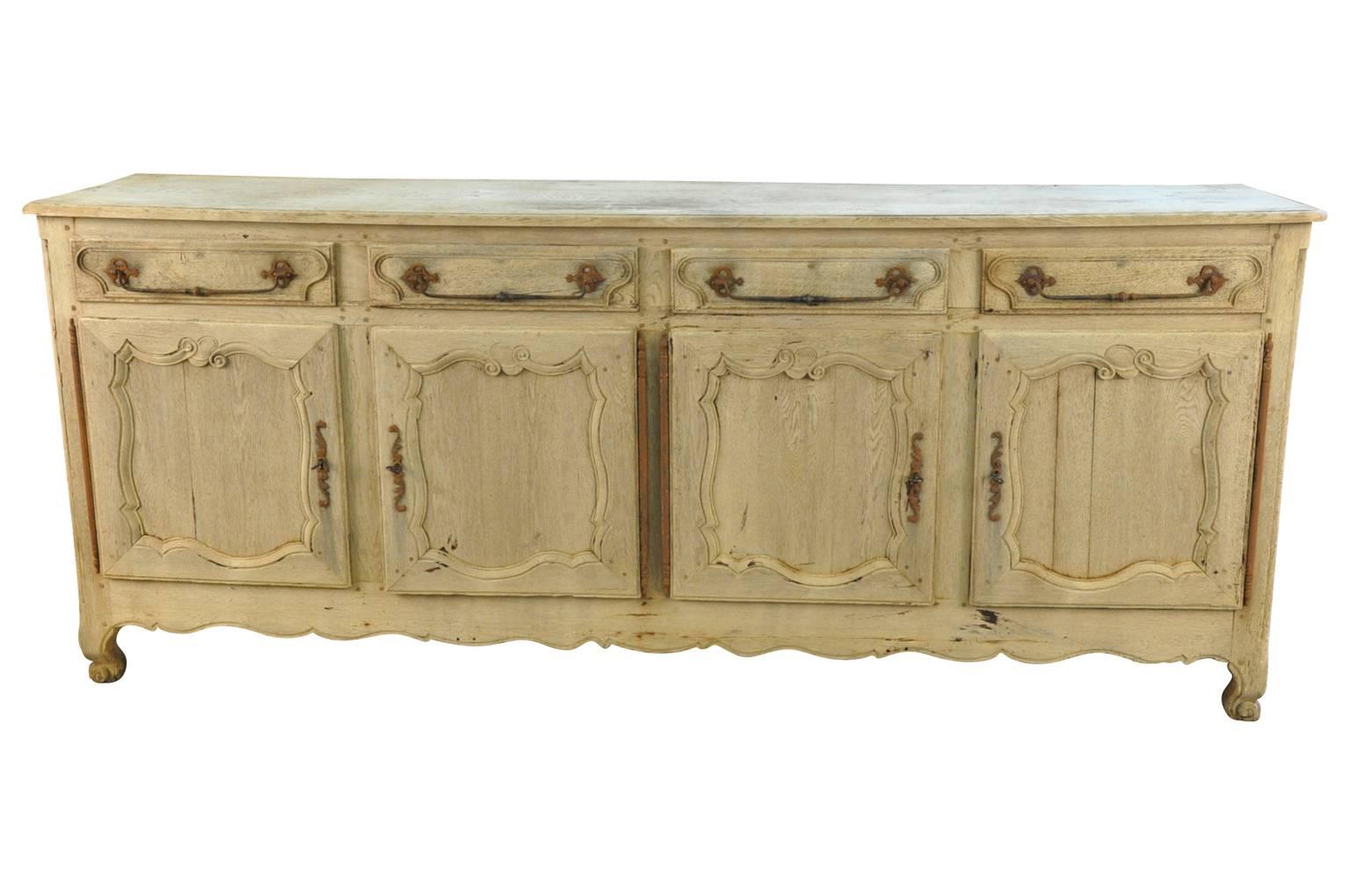 A very lovely mid-19th century enfilade or buffet from the Provence region of France. Handsomely constructed from washed or bleached oak. Wonderful hardware.