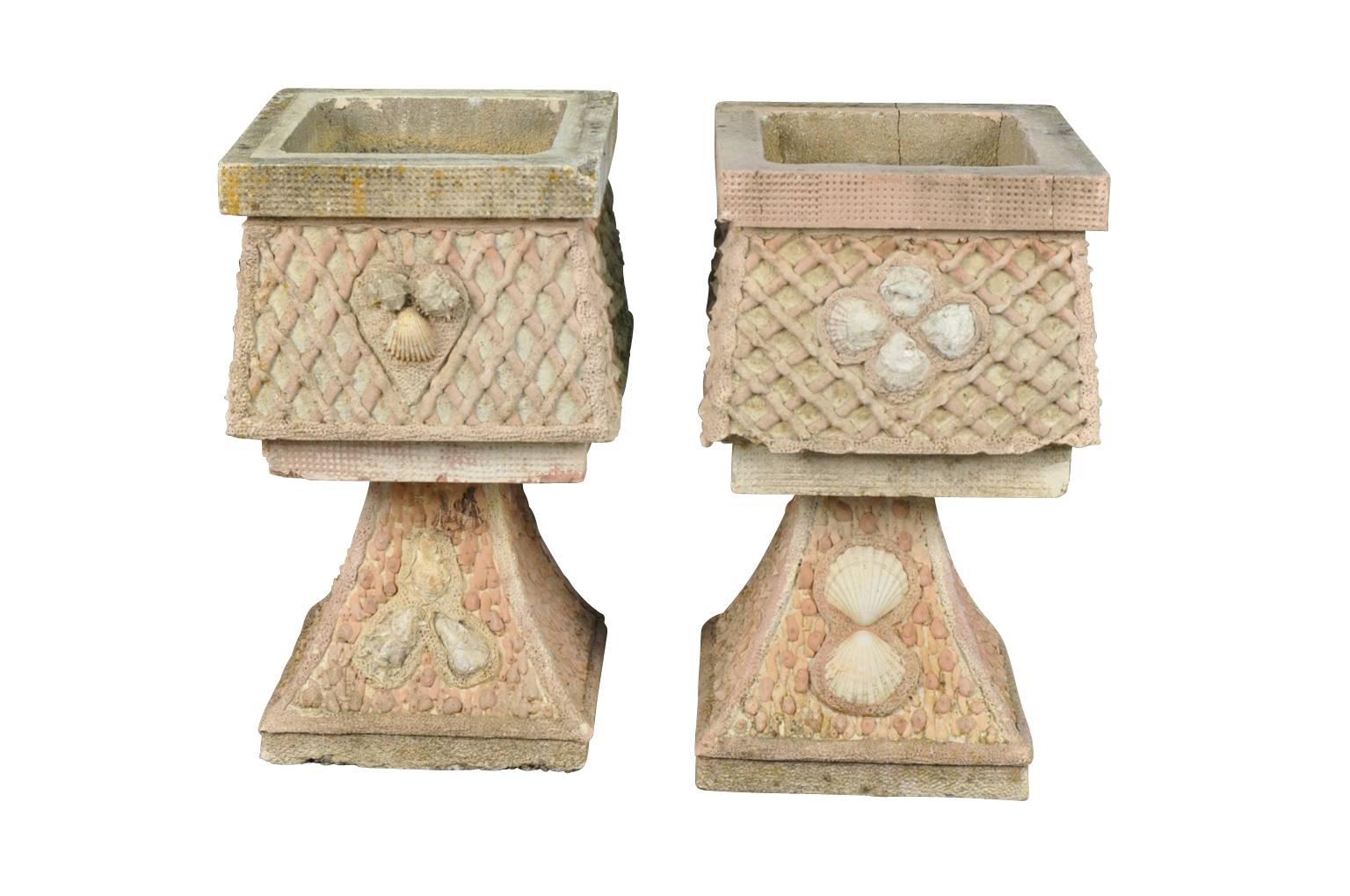 A sensational pair of vintage French jardinieres, planters from the South of France. Wonderfully constructed from coade stone and sea shells.