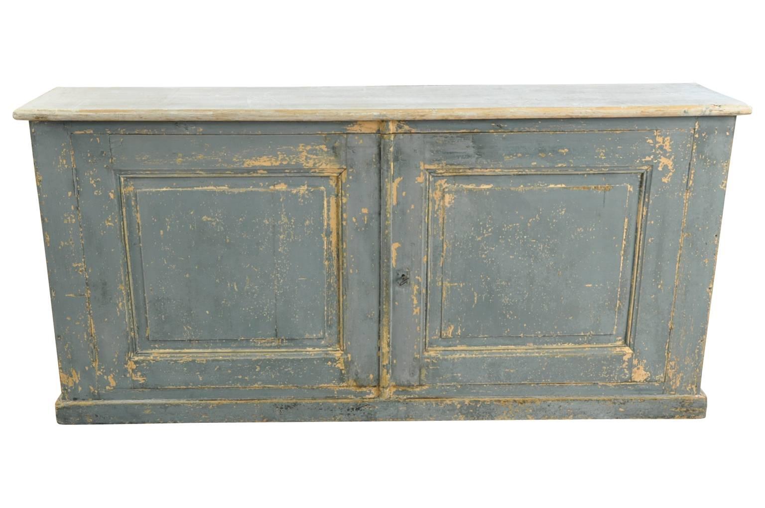 A charming later 19th century buffet from the South of France. Soundly constructed from painted wood. Terrific narrow depth. Wonderful painted finish and patina.