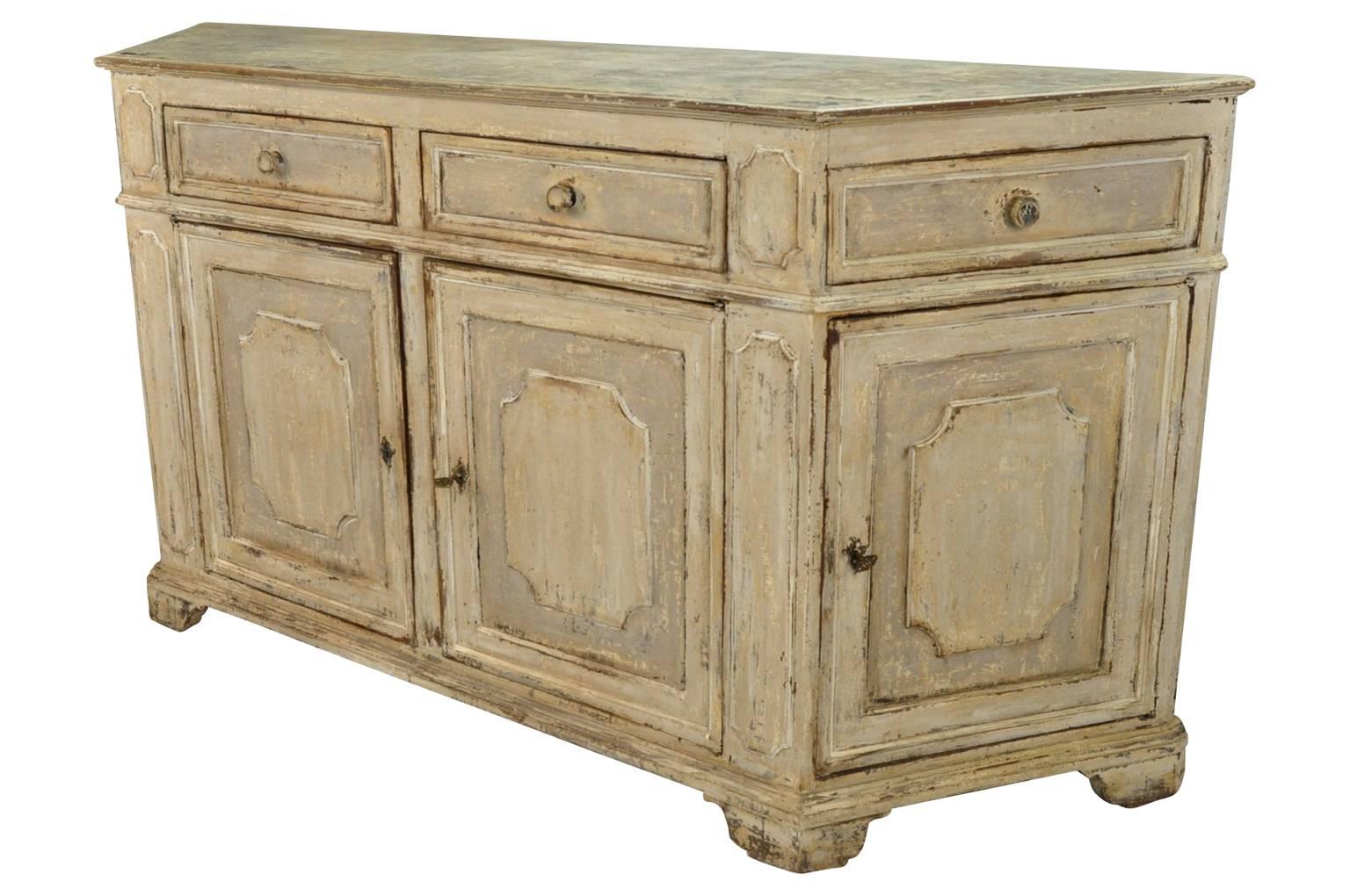 An outstanding late 18th-early 19th century credenza from Tuscany. Beautifully constructed with canted sides, four drawers and four doors. The patina and finish is wonderful. A terrific storage piece lending great style to any interior.