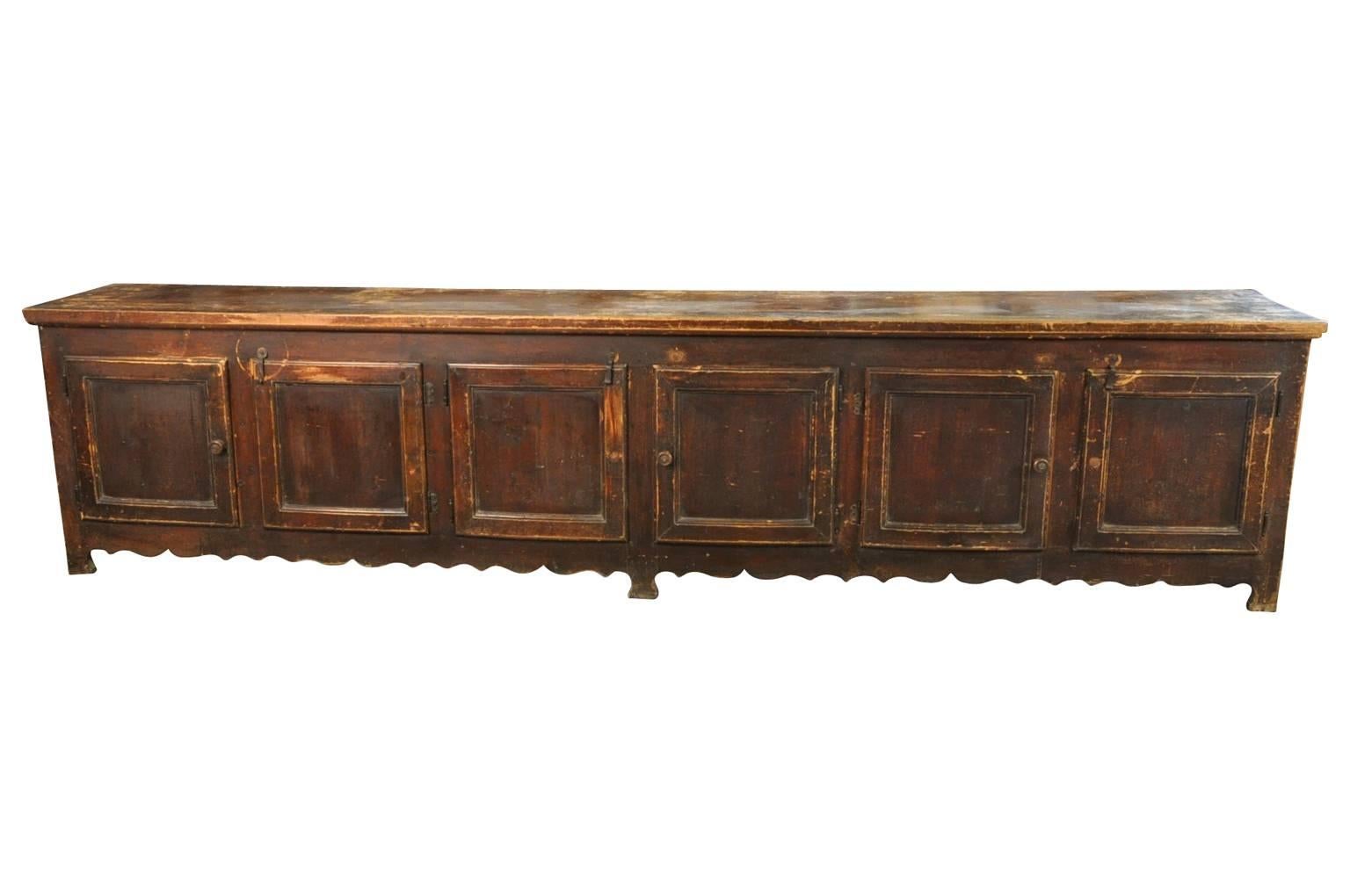 A terrific grand scale enfilade - buffet from the South of France.  Wonderfully constructed with six doors and a delightful sculpted apron.  A tremendous storage piece.