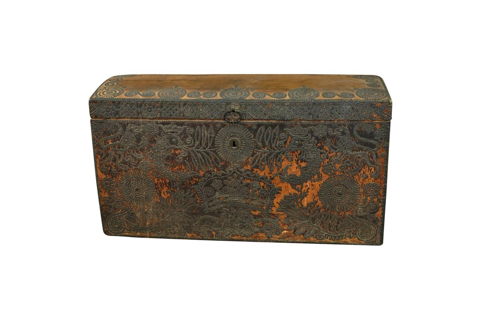 An exceptional 18th century Marriage Trunk - Malle - from the Provence region of France. Soundly constructed from wood and clad in leather. Beautifully decorated with bronze nail heads in the form of petite flowers. Wonderfully decorated with