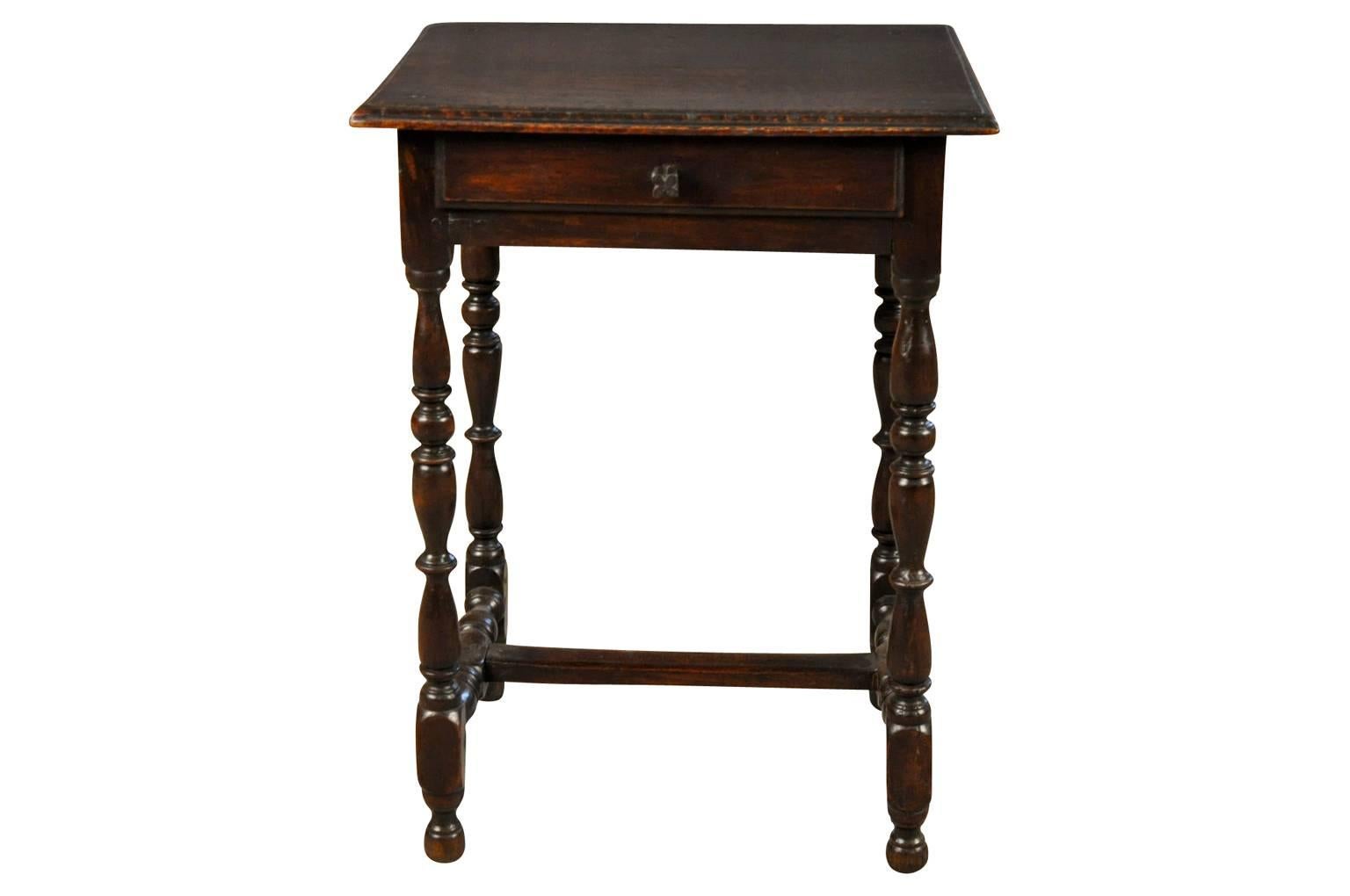 A delightful early 19th century Louis XIII style side table from the south of France. Beautifully constructed from richly stained oak with charming details throughout - a wonderful edge finish to the plateau, a single drawer and handsomely turned
