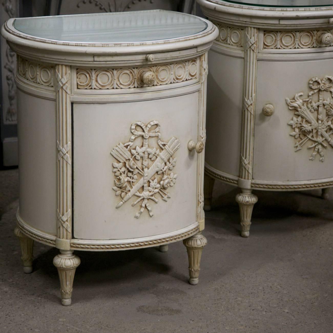 This pair of round painted neoclassical nightstands feature a delightful semi-oval design that presents a softened impact on the room, especially when you consider the patinaed painted finish that lends a light and airy look as well as accentuates