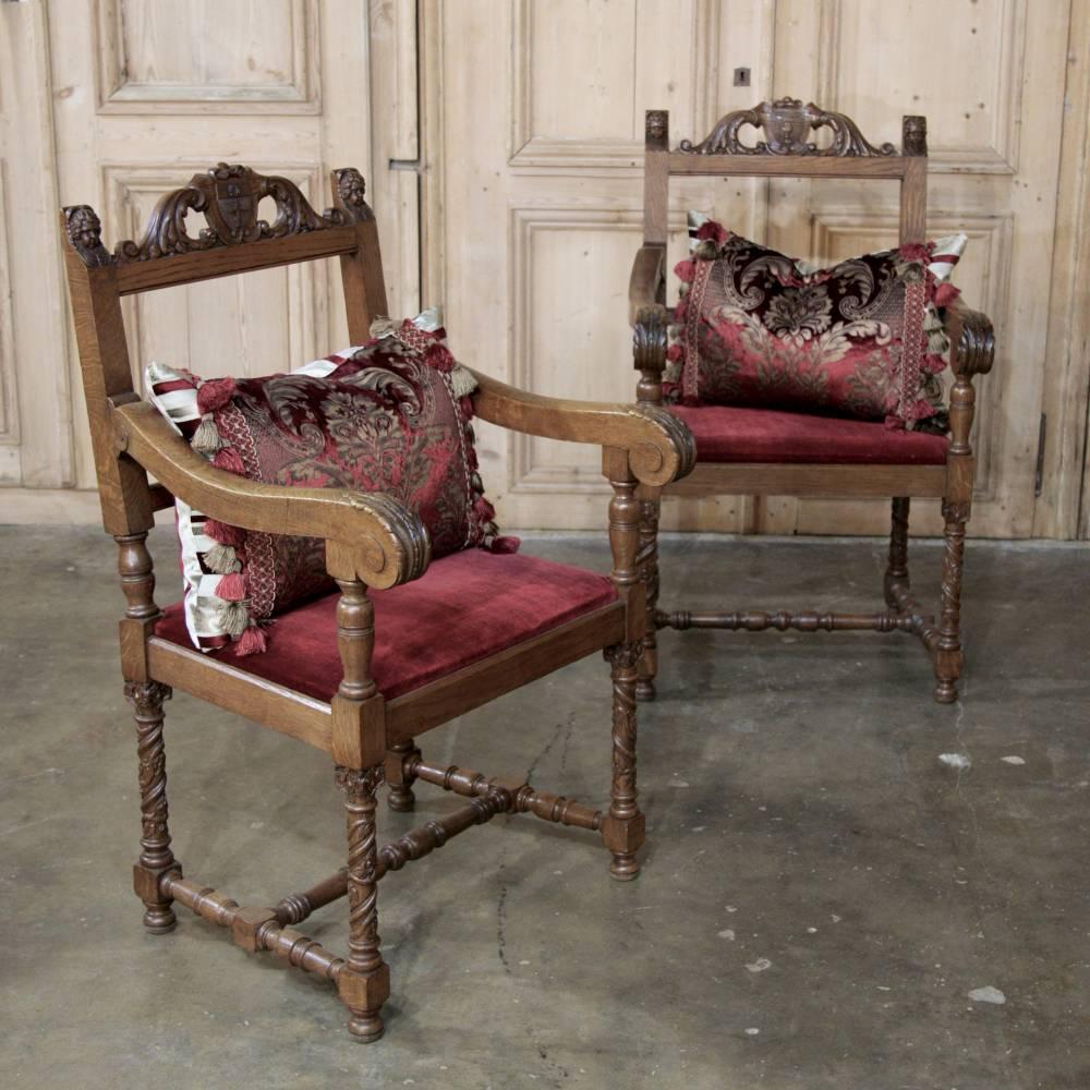 Pair of 19th century cleric's armchairs were carved from solid old-growth oak with a nod to the Renaissance style, and represent the essence of tailored lines with a pronounced Gothic influence in the column leg supports making them a wonderful