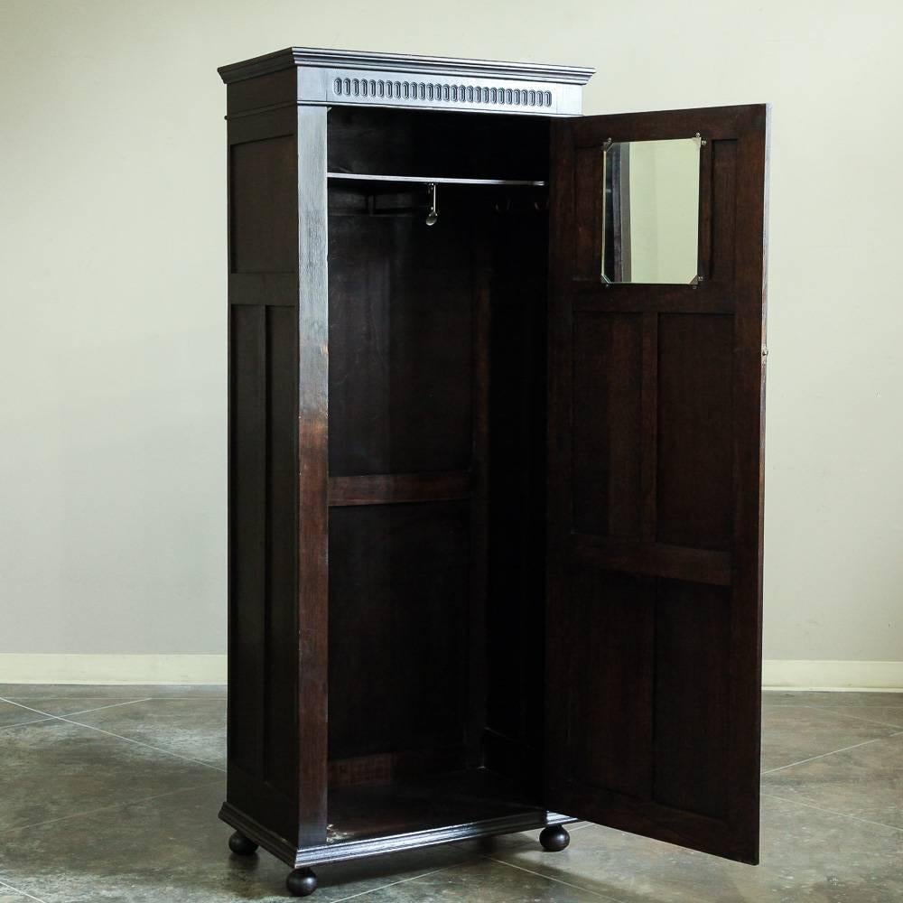 This charming antique Country French bonnetiere or armoire features a square-rigged sailing ship carved into the top panel! The perfect width for that special niche, it makes a great addition to any room that needs a tad more storage in