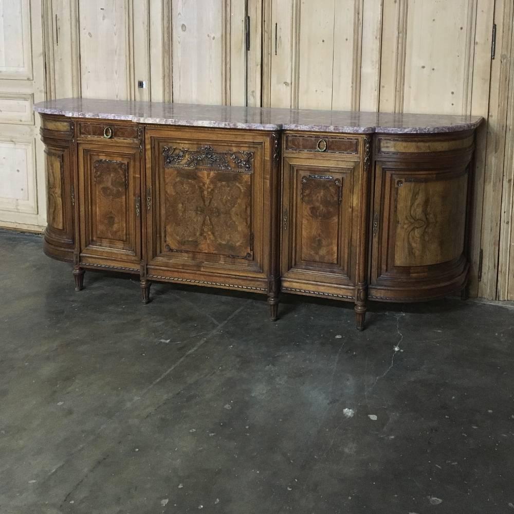 19th century French Baroque marble-top buffet features step-front center section with rounded sides and burl veneer panels with inlaid detailing. Original cast bronze drawer pulls and amazingly capacious interior add a nice touch, but the timeless