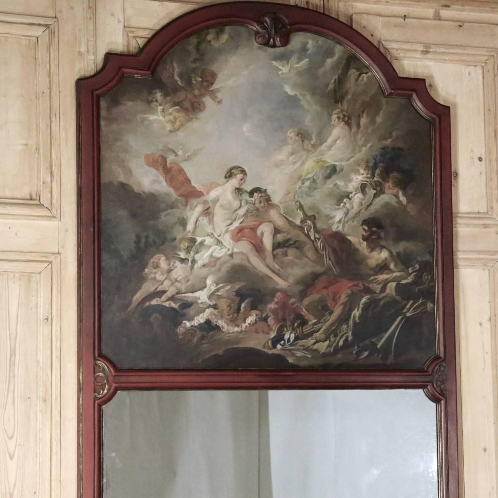 Featuring a gloriously arched framework sculpted and hand-carved from old-growth oak, this gorgeous 19th century French Regence Trumeau boasts its original romantic hand-painted oil on canvas atop the generously sized mirror below for a wonderful