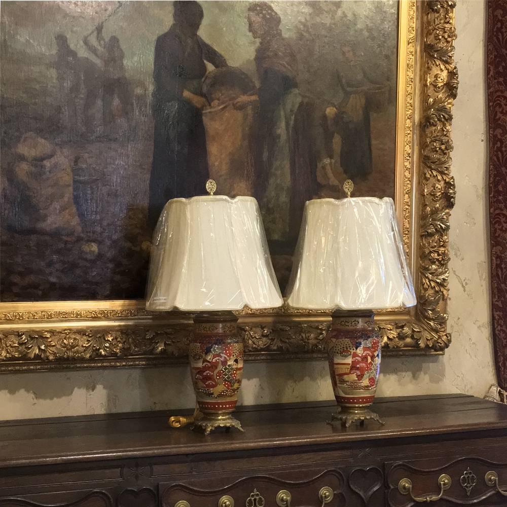Pair of 19th century Satsuma table lamps add a stunning oriental ambiance to your room along with subtle lighting that will allow you to more fully appreciate the rest of your decor! Hand-painted to perfection, glazed with an amazingly long-lasting
