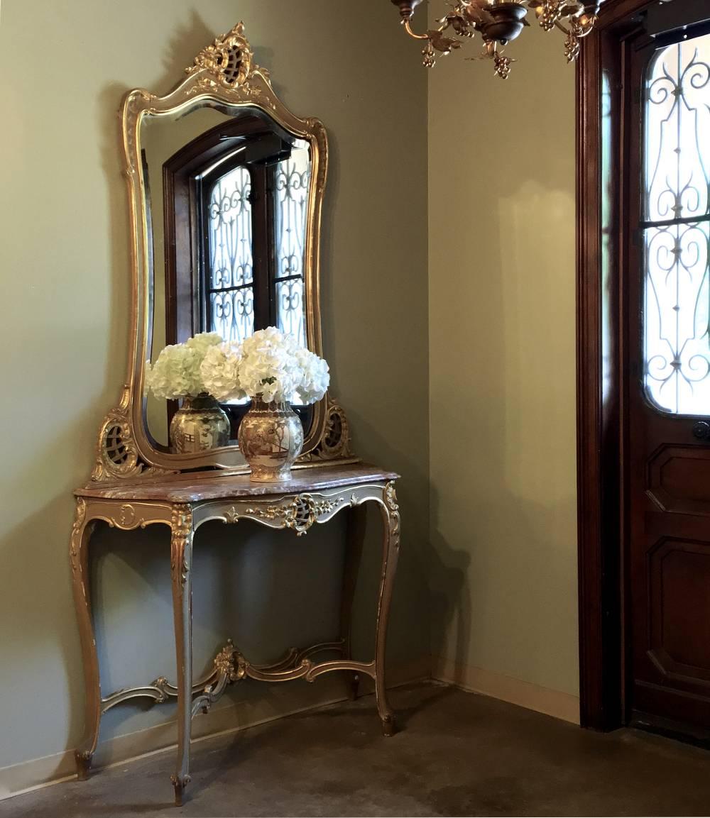 Possessing a grace and beauty that is a hallmark of the Rococo style movement, this stunning 19th century Italian Rococo marble-top console and matching mirror feature their original painted finish with gold highlights for a spectacular effect!