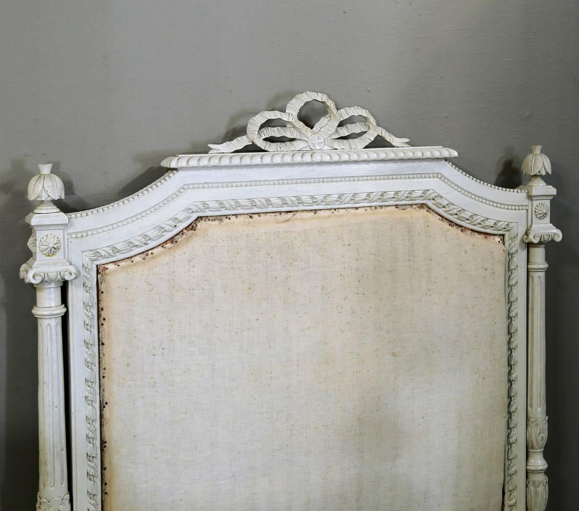 This remarkable pair of 19th century French Louis XVI neoclassical twin beds feature their original painted polychrome finish that has achieved a lovely distressed patina over the lat century! Ostrich plume finials punctuate each fluted and tapered