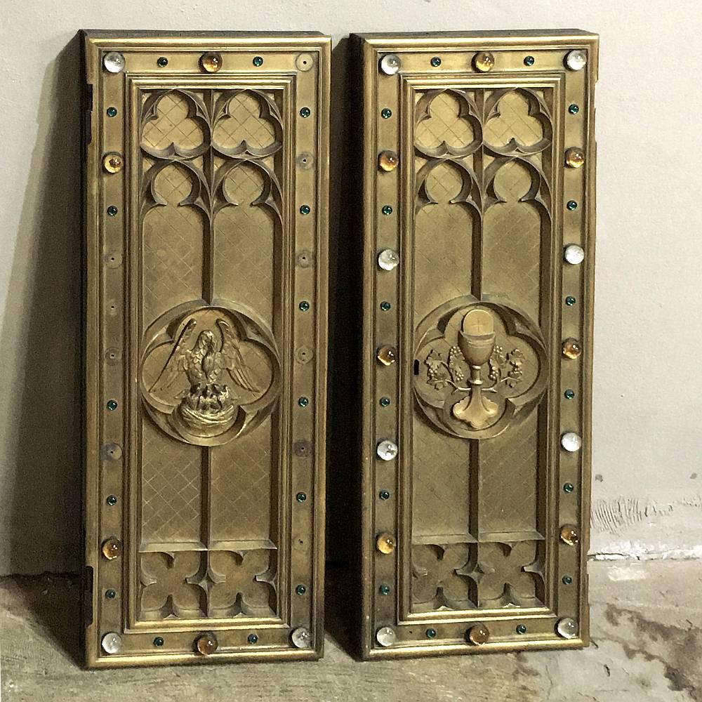 This stunning pair of 19th century bronze tabernacle doors are amazing works of art, with the pelican symbolizing the sacrifices of a devoted mother featured on one door and a chalice representing communion on the other. Intricate gothic-inspired