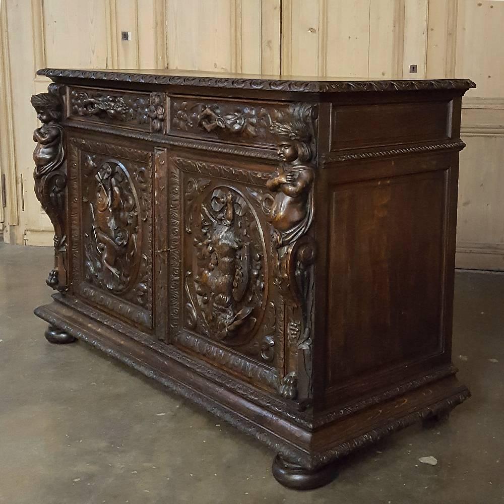 Ideal for the masculine decor, 19th century French Renaissance Hunt buffets such as this exceptional example are getting harder to find each year! Sculpted in glorious full relief on the front appear scenes from the hunt and a fishing expedition in