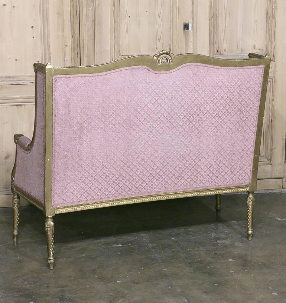 19th century French neoclassical Louis XVI gilded sofa - Canape is the essence of opulence with a design that dates back to ancient Greece and Rome! Skillfully hand-carved then given a gilded finish, it is upholstered in velvet and will make the