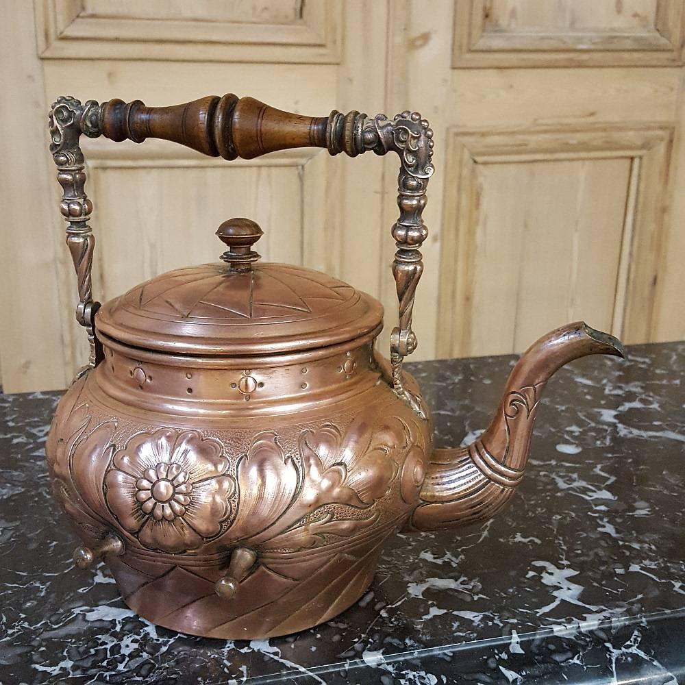 A most unusual find, this extraordinary 19th century wrought iron and copper tea serving stand is an amazing combination of artistry, design and craftsmanship! The wrought iron stand and cradle were designed specifically to hold this particular