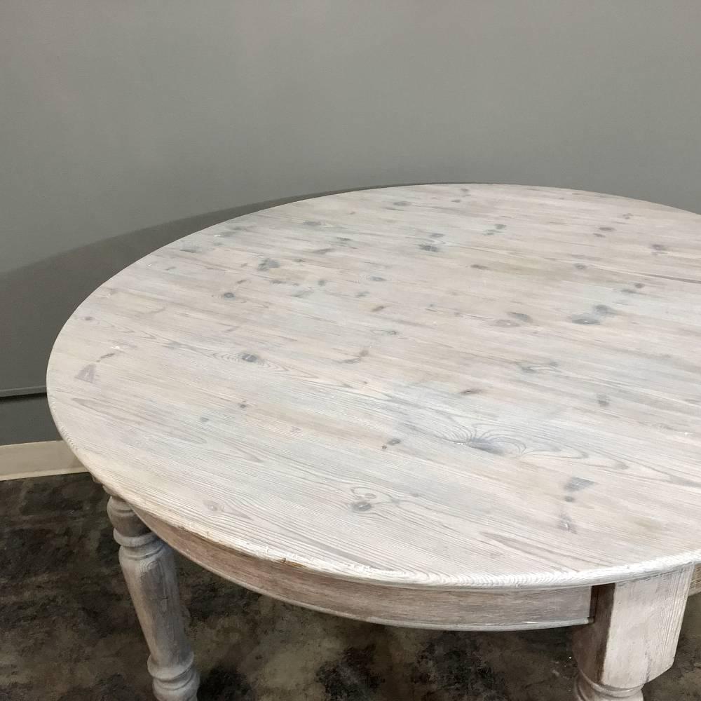 round white washed dining table