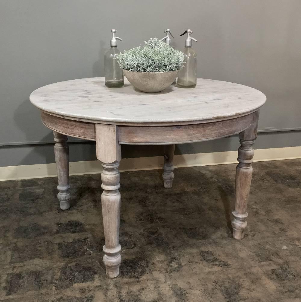 The tailored lines of this antique country French round whitewashed dining table also excellent as an antique rustic centre table, make it ideal for casual decors! The whitewashed finish gives it a soft appearance that helps blend it with the rest
