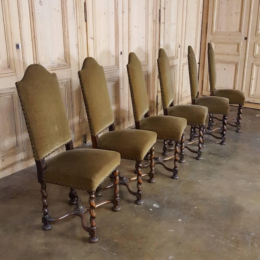 Newly upholstered in sumptuous tapestry fabric, this handsome set of six Louis XIII style barley twist dining chairs will make the perfect choice for that Old World look! Hand-crafted from fine walnut, each features a high arched seatback and