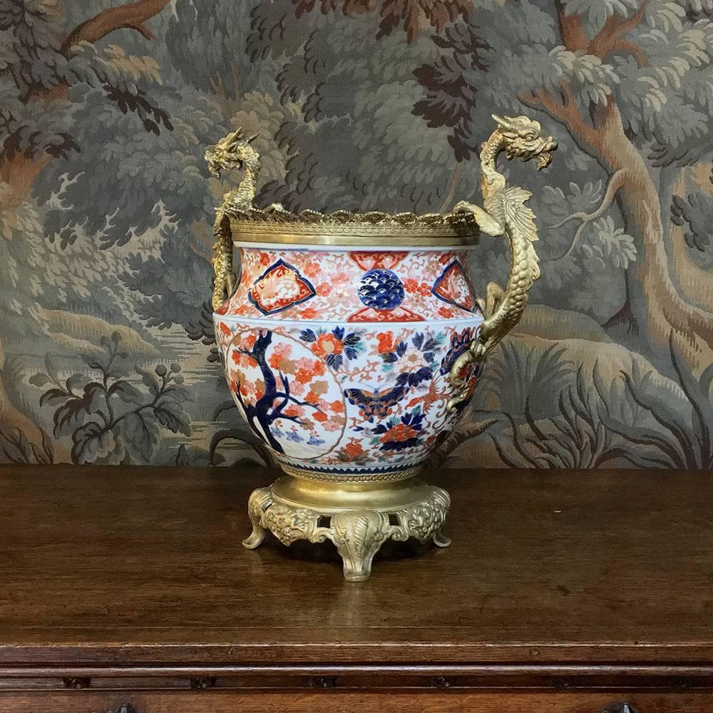 The ultimate in opulence, this 19th century hand-painted Imari vase with bronze dragons will make a stunning centerpiece and steal the show in any room!
circa 1880s
Measures: 16 H x 16 W x 11 D.