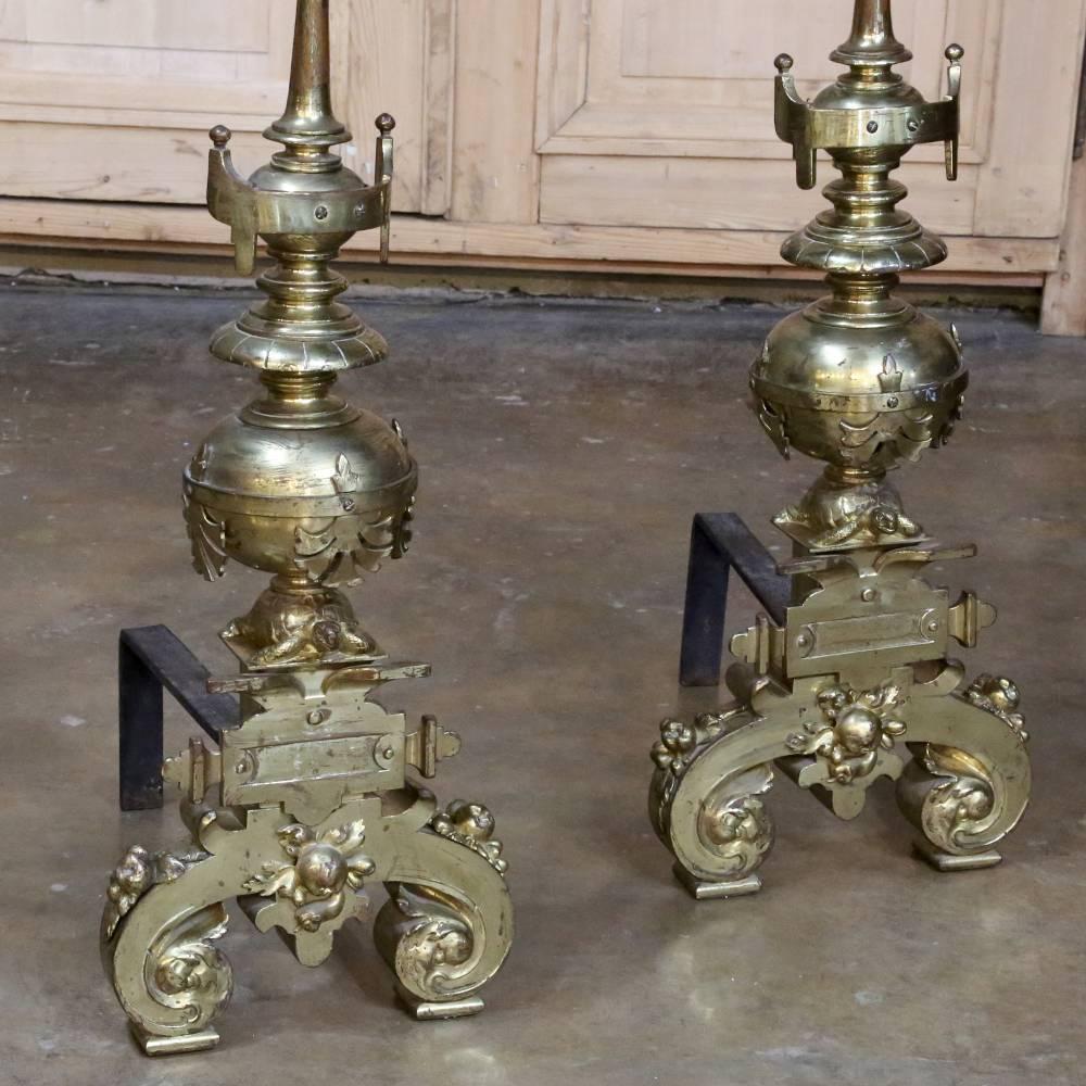 Pair of 19th century bronze andirons boast elaborate style and grand scale to set off your room's focal point with panache! The flame motifs on top are extended by a tapered column from the urn motif just above the centre, with an orb just