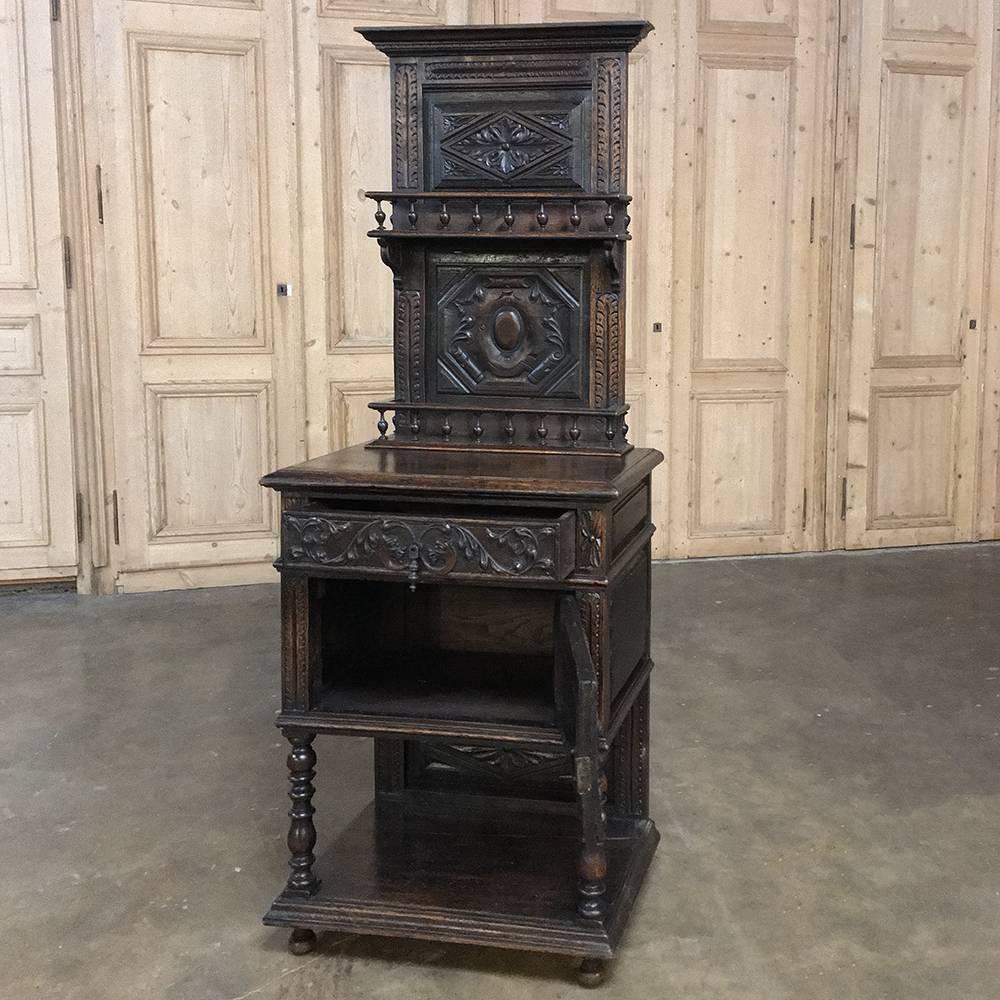 19th century French Renaissance Petite Vaisselier buffet is a unique example of the master furniture crafter's art! A crest centered with an egg motif appears on the main cabinet door, with a drawer above lavished with foliates and gryffin's heads