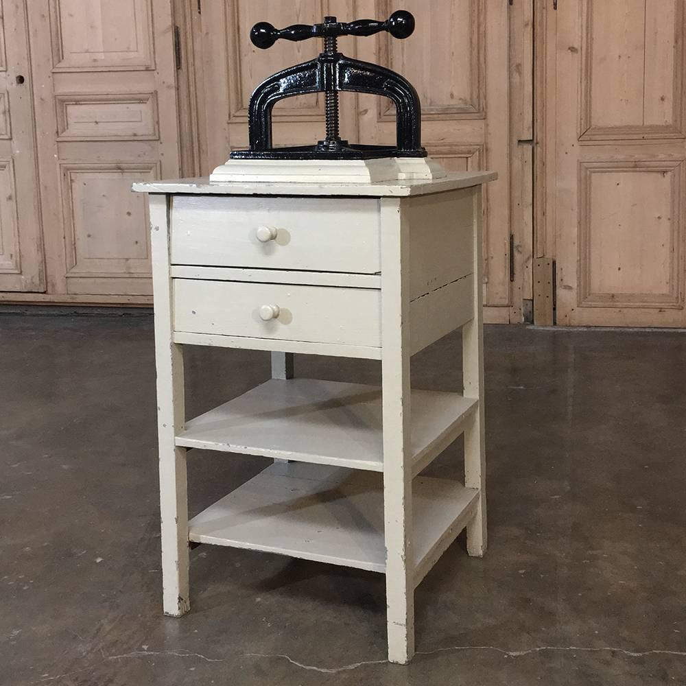 This 19th century cast iron paper press on painted stand is amazingly well preserved, and still perfectly functional after well over a hundred years of service! Thanks to its solid cast iron construction, and original Stand that has been