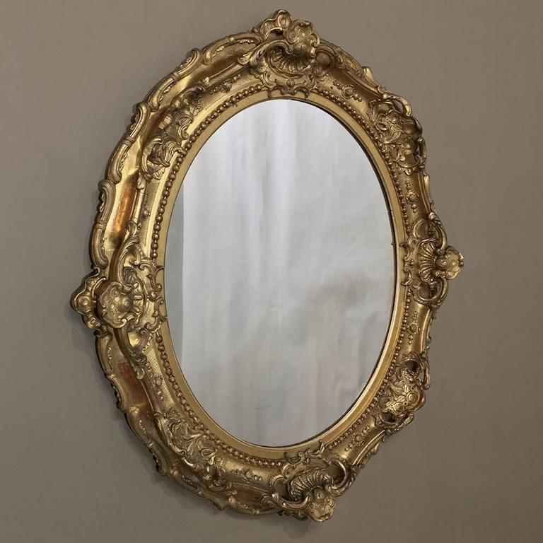 19th Century Gilded Baroque Oval Mirror For Sale at 1stDibs