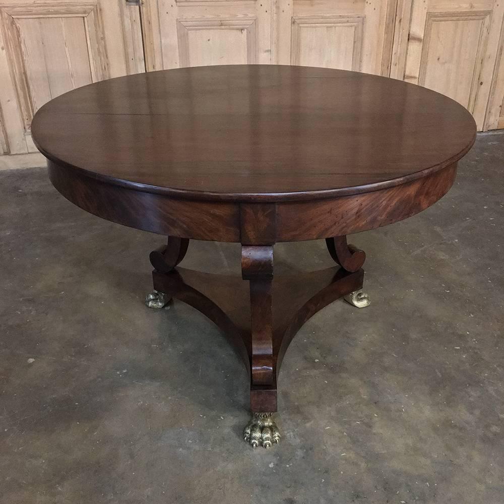 19th century english Regency period mahogany claw foot centre table is the essence of the style with the sheer natural beauty of the exotic imported wood shining through the design, accentuated by the cast bronze lion's paw feet!
circa