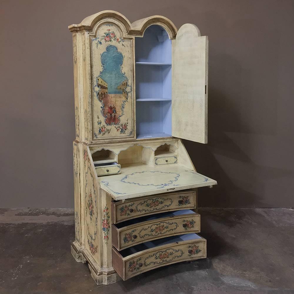 Antique Venetian painted secretary bookcase showcases the flair for the dramatic that characterizes artwork, sculpture, and furnishings from Venice. This example, with bold double crown atop the bookcase section, features a slant-front drop-down