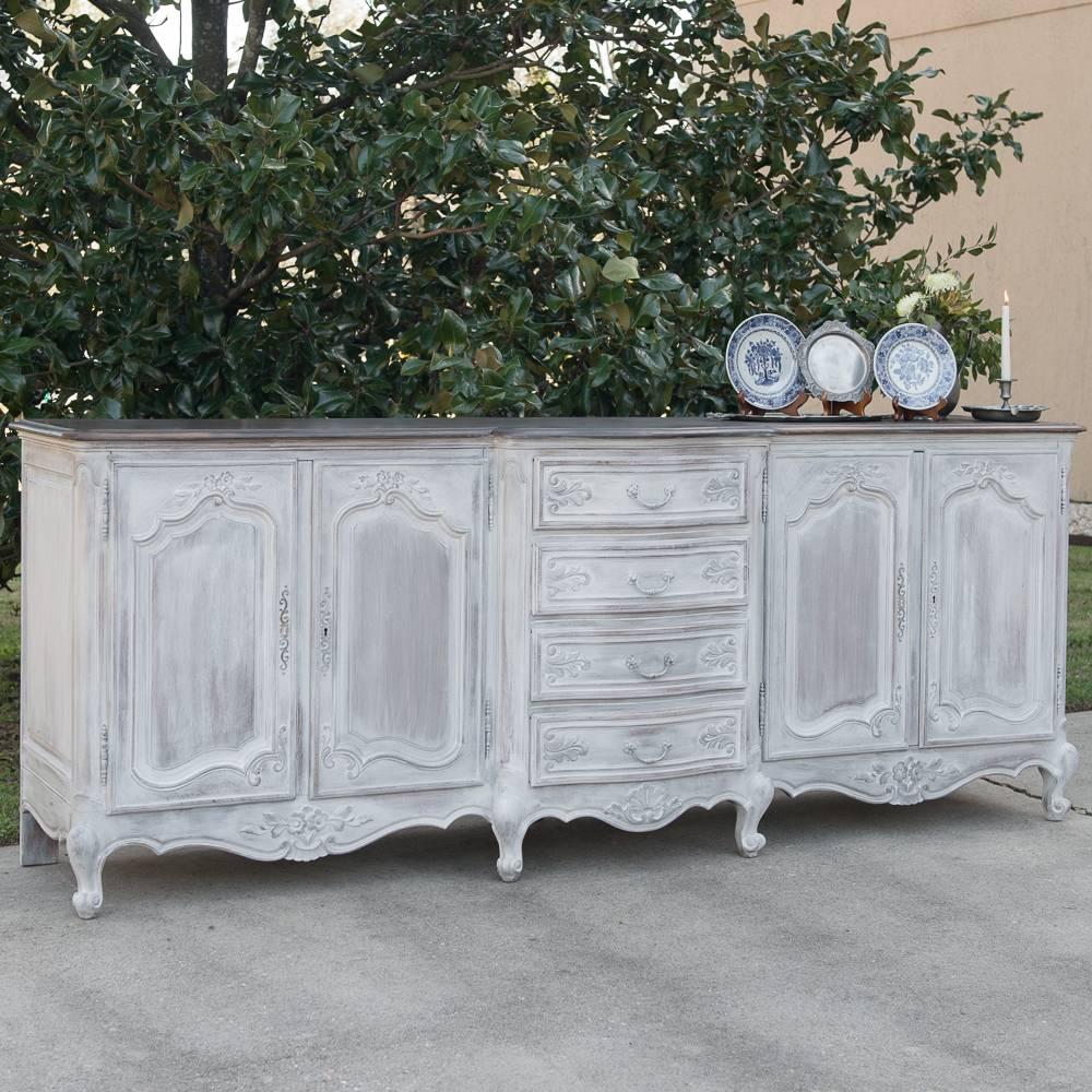 Grand Country French Solid Oak Painted Whitewashed Finish, Dark Waxed Top Buffet boasts four cabinets and four drawers in a bow-front centre section for copious storage and serving surface in Provincial style,
circa mid-1900s
Measures: 37.5 H x 97 W