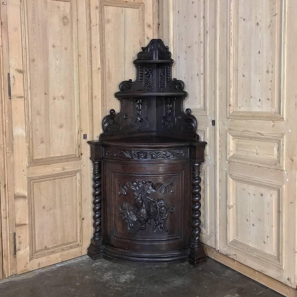 Pair of 19th century French Renaissance corner hunt cabinets are ideal for creating symmetry in a masculine decor! Each is almost six feet in height to the top of the corner-backsplash, and each features a top tier, middle shelf, and generous