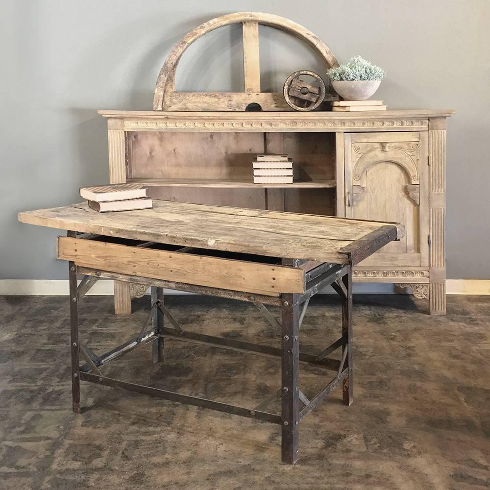 Antique industrial work table is ideal as a student's desk, a sofa table, or hall table, and a perfect choice for the casual decor! Handcrafted from steel and oak to last for generations!

circa early 1900s.

Measures 33.5 H x 58 W x 24.5 D.