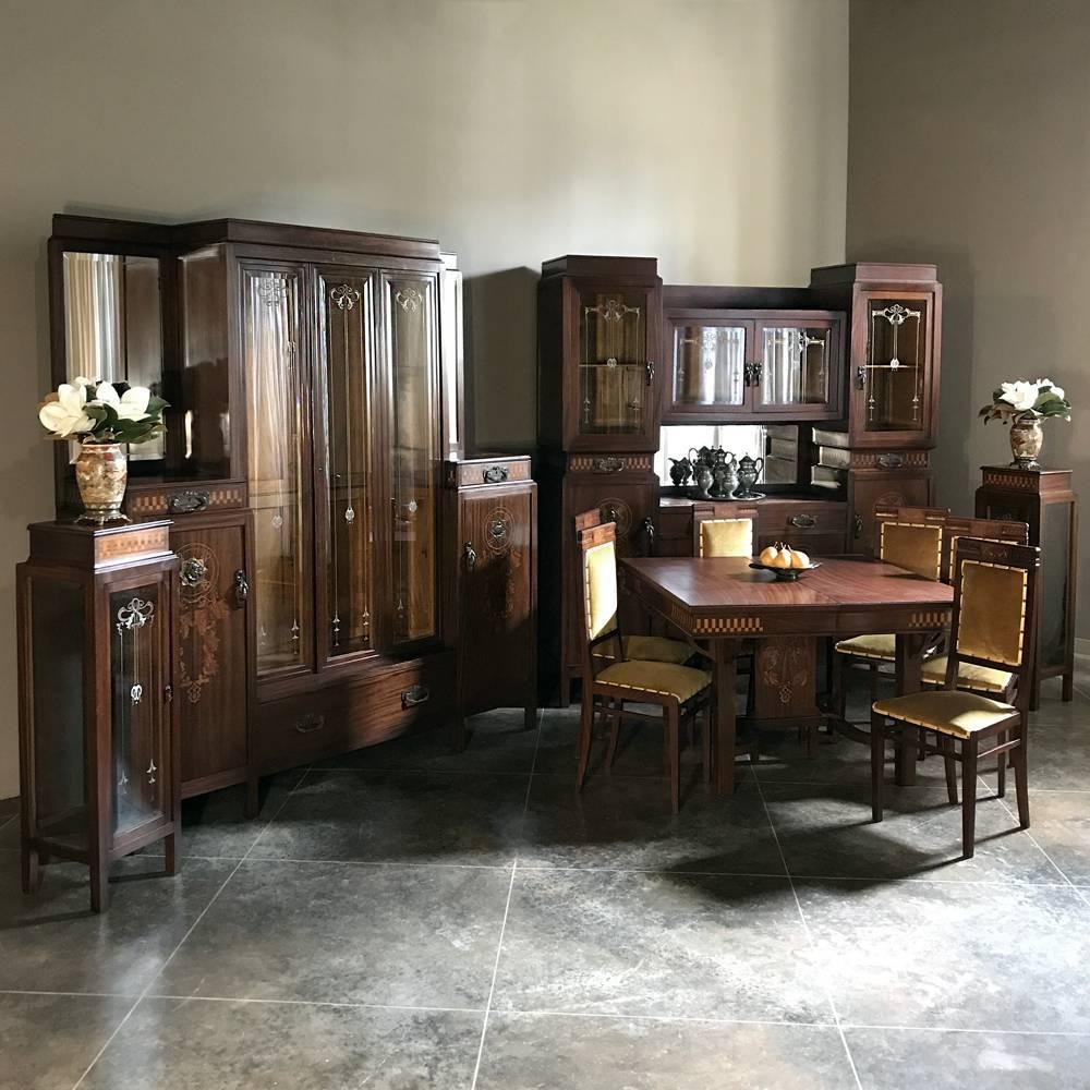Pair of Italian Art Deco mahogany marquetry vitrines or cabinets are a splendid example of the artistry of the period, with exotic imported mahogany from the Americas serving as the backdrop for exquisite inlay work in contrasting species of Fine