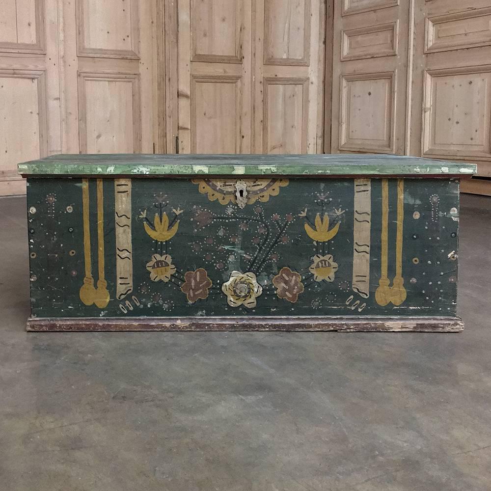 This 19th century Swedish painted trunk was decorated in a lively country fashion by Swedish artisans and as functional as it is attractive, is perfect for adding color and storage space to a home. Constructed of the locally available pine, its