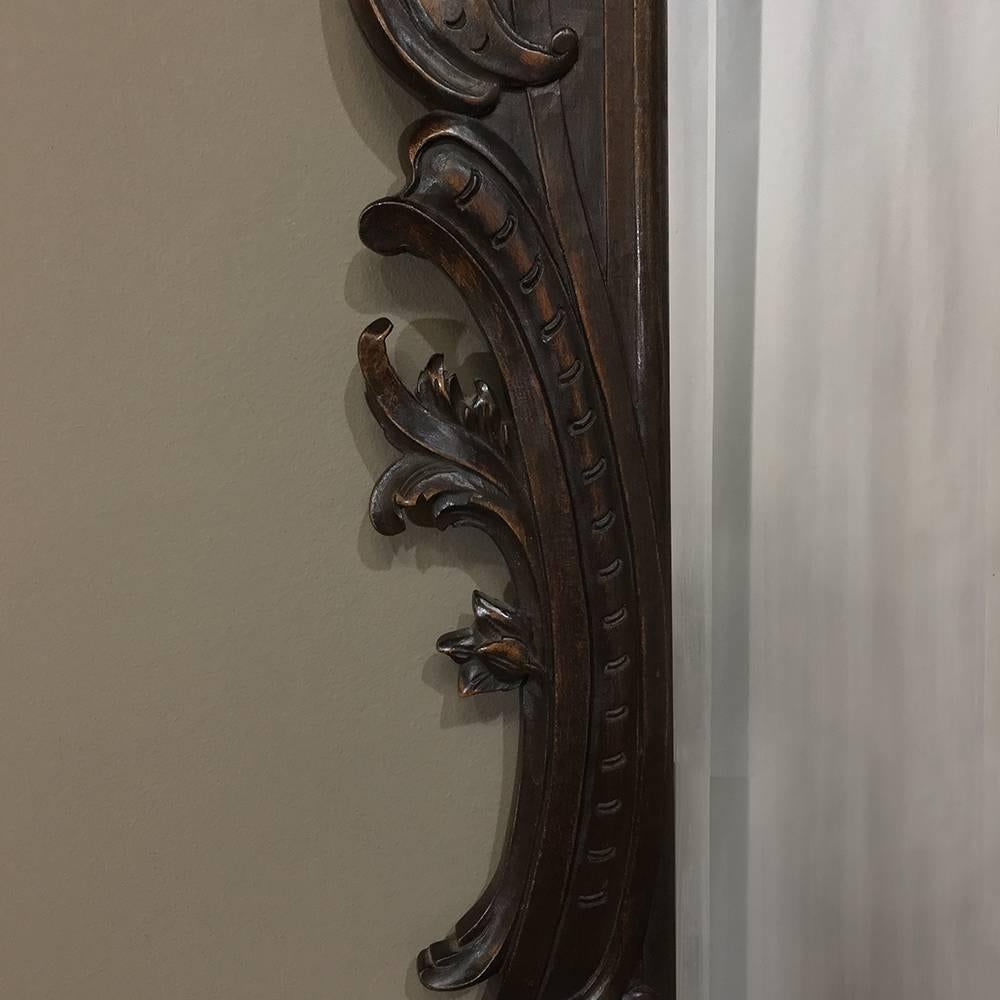 19th century French Regence style carved wood with original bevelled mirror was sculpted from solid oak and features incredible artistry in every scroll, foliate, shell, wing and embellishment,
circa 1890s.
Measures: 37 H x 27 W x 1 D.