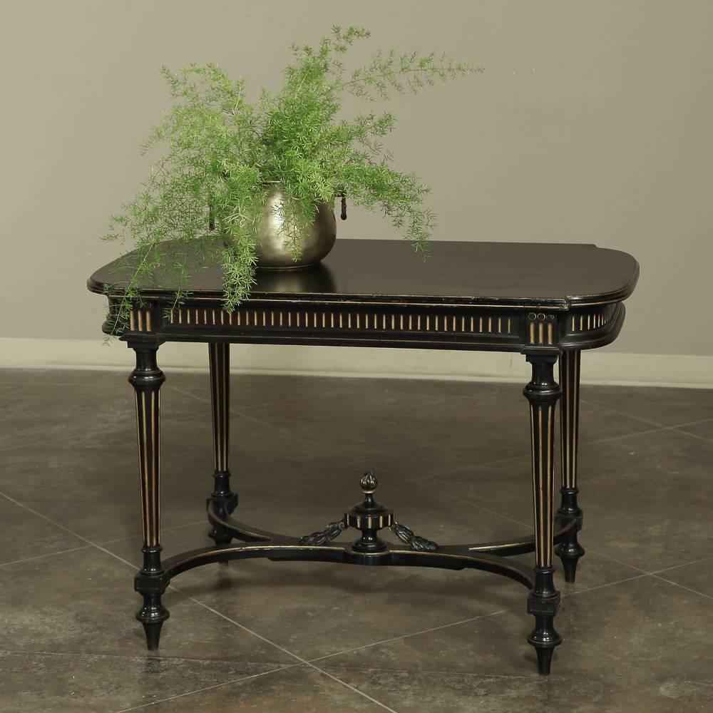 19th century French Louis XVI neoclassical ebonized end table is a splendid example of the process by which local woods such as walnut were impregnated with carbon black in a process completely dissimilar to today's wood staining. The 